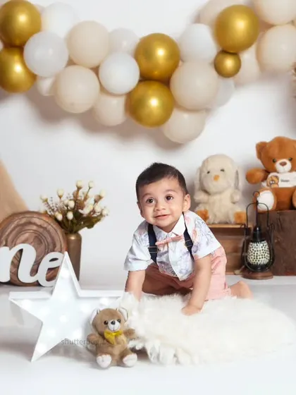 A sweet baby crawling on a fluffy rug, surrounded by the neutral tones and textures of our boho theme.