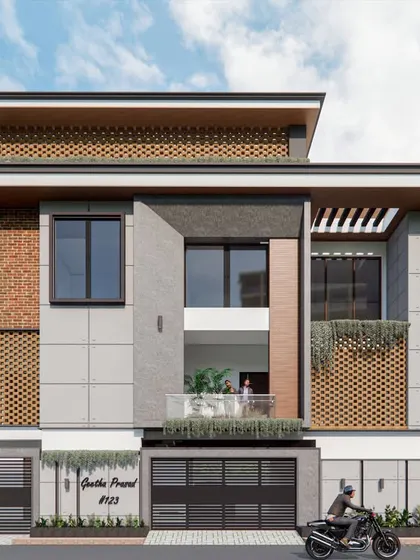 A fusion of contemporary and traditional house design. This elevation combines modern grey panels with the warmth of exposed brick and jaali screens.