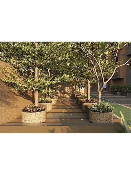 We create immersive experiences like this walkway through a dense grove of trees, providing a refreshing, nature-filled transition within the residential complex.