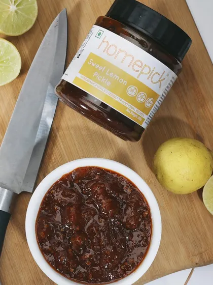 Our Sweet Lemon Pickle is a perfect balance of tangy and sweet. Made with traditional recipes, it's a must-have for your morning paratha or lunch dabba.
