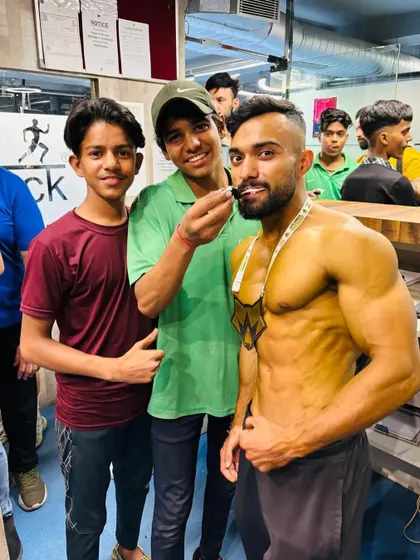 The sweet taste of victory. Celebrating a client's win after weeks of disciplined training and diet. This is the reward for all the hard work.