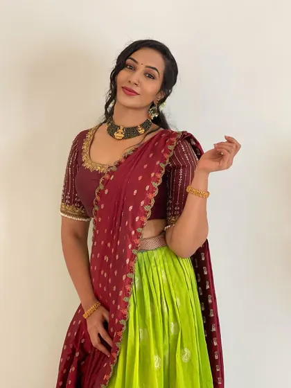 A smiling pose in our rental half saree. This outfit is perfect for pre wedding ceremonies, festivals, or if you are a wedding guest wanting a traditional yet comfortable look.