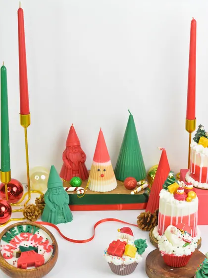 A festive flat-lay of my entire Christmas collection, showing the wide range of creative designs from cake candles to taper candles, all designed to bring holiday magic to your home.