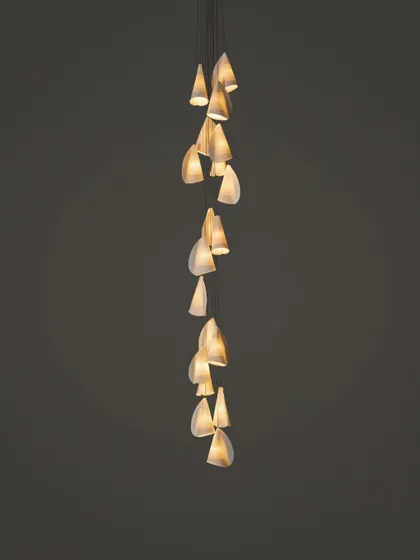 A long, cascading installation of the Bocci 21 series, its form elegantly spiraling downwards.