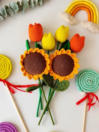 A cheerful collection of my handmade creations, including crochet sunflowers, tulips, and fun macrame lollipops. Perfect for any celebration.