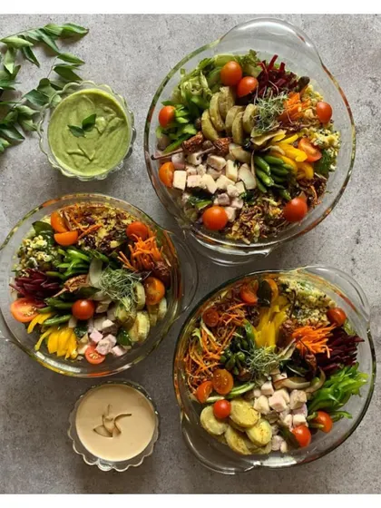 A top-down view of our Earthy Malabar Salad Bowls, ready for delivery. Each bowl is a soulful mix of cumin-spiced taro, sweet potato, and fresh greens, capturing the essence of the Malabar coast.