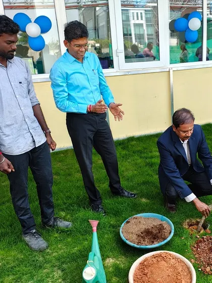 Our team member guides a client during the ceremonial planting, symbolizing the collaborative partnership we build with every corporate client.