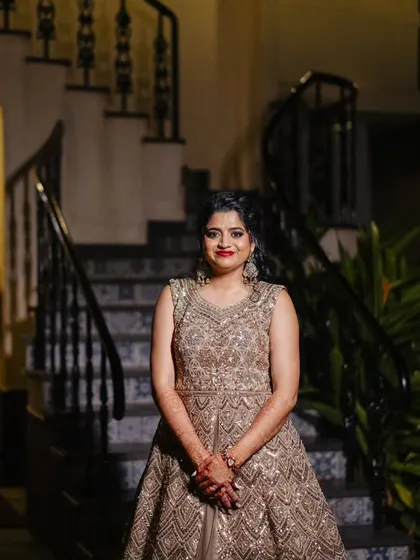 This bride is all smiles, looking radiant for her sangeet. The makeup is glamorous but not heavy, ensuring she feels comfortable all night.
