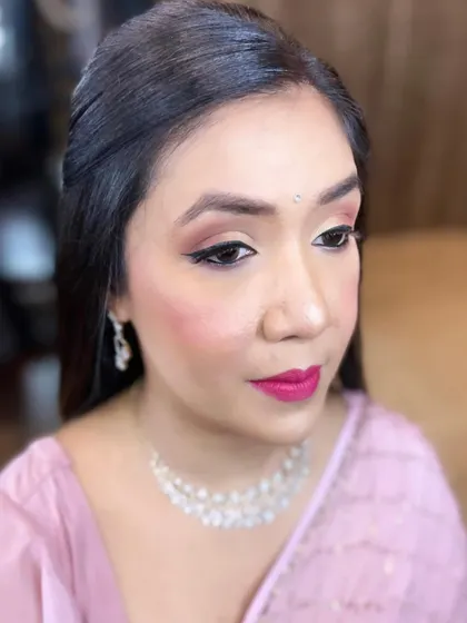 This look is perfect for a reception or party, providing a touch of glamour while still looking natural and fresh.
