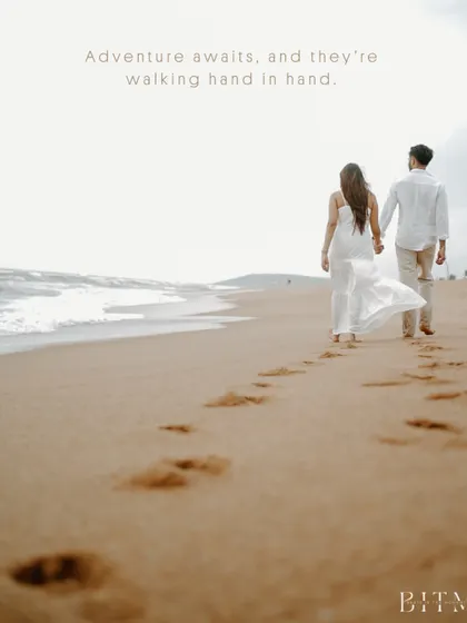 Footprints in the sand leading towards the ocean in Goa. This symbolic image of the couple walking hand-in-hand represents the beginning of their shared journey, a simple but powerful pre-wedding concept.