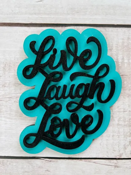 A classic reminder to "Live Laugh Love." This hand-painted magnet adds a pop of color and positivity to your fridge or workspace.