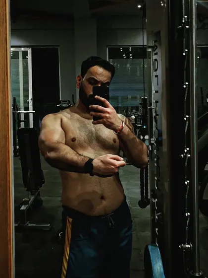 Capturing the results at the end of a bulking season. This phase is all about strategic eating and heavy lifting to build a solid foundation of muscle mass.