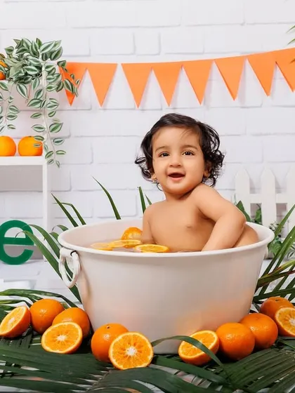 A full setup of the orange-themed tub splash, showing the happy baby and all the fun details.