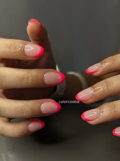 Another angle of the popular neon pink French manicure, showing how the custom sizing fits perfectly across all nails for a seamless and comfortable wear.
