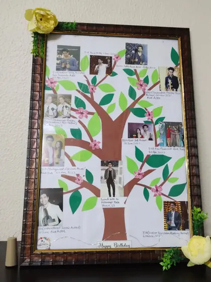 A view of the "Awards Tree" frame without the lights on, showing the papercraft details of the leaves and flowers.
