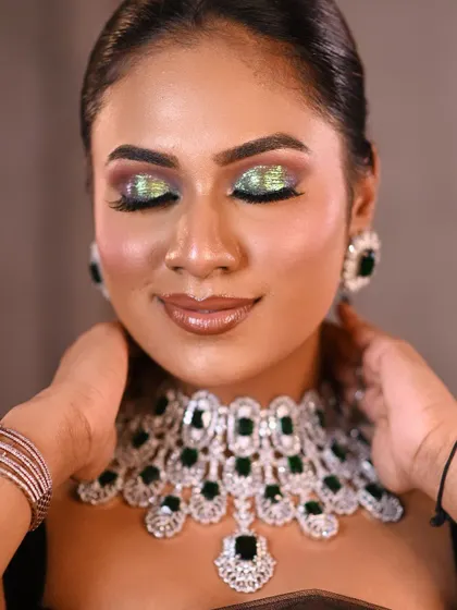 A glamorous makeup look with a bold, glittery eyeshadow. This close-up captures the artistry of the makeup, showing the fine details and vibrant colors with perfect clarity.