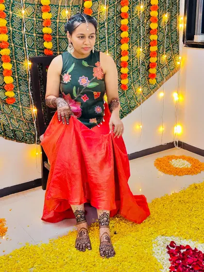 A client ready for a festive occasion, with beautiful mehendi on her hands and feet.