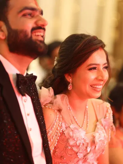 A close-up shot of the couple sharing a laugh during their engagement ceremony. Capturing these unscripted, happy moments is key to my storytelling approach, as they reveal the genuine joy of the day.