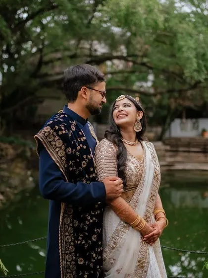 A tender moment during the sangeet night. The soft lighting and genuine smiles create a warm and romantic atmosphere, perfect for capturing the couple's love story.