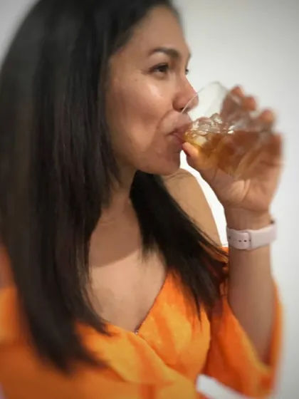 A guest enjoying the first sip of a freshly prepared cocktail. This is the moment of truth, where all the preparation and craft come together.