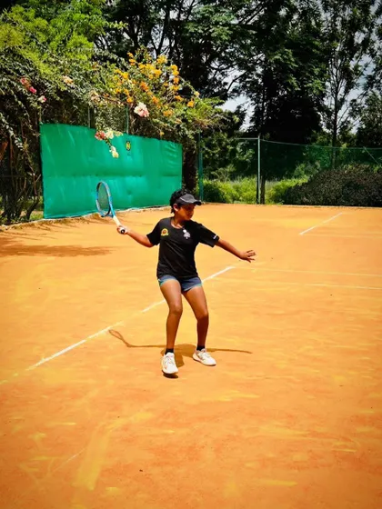 An action shot of one of our junior players, Eeshita, mid-rally during a training match. This captures the focus and intensity we instill in our athletes from a young age.