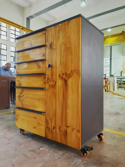 This mobile cabinet, complete with multiple drawers and a cupboard section, is a testament to the comprehensive furniture-making skills our students acquire.