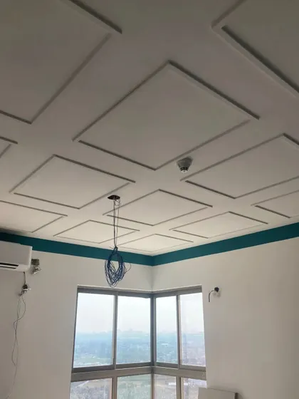 Look up! We believe ceilings are the fifth wall and deserve just as much design attention. This coffered ceiling adds a touch of classic elegance and architectural interest to the room.