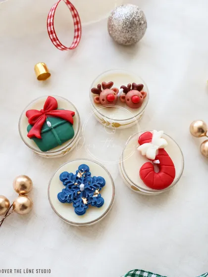 Four of my favorite Christmas tealight designs: the gift, the reindeer, the snowflake, and the candy cane.