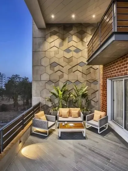 This spacious balcony features a striking 3D geometric tile wall, creating a modern and artistic backdrop. The comfortable outdoor furniture makes it an ideal spot for relaxation and social gatherings.