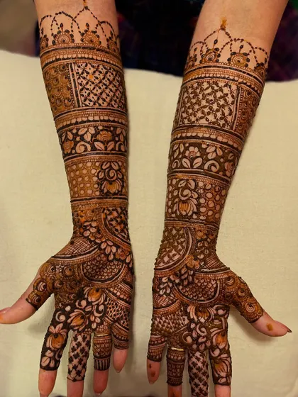 This traditional design features bands of different patterns, creating a beautiful striped effect on the arms.