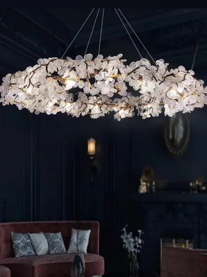 This stunning wreath-like chandelier is adorned with countless small, flower-shaped crystals. It's a breathtaking centerpiece for a dark, moody room.
