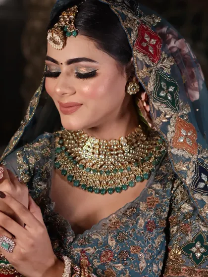 An intimate close-up showcasing the soft, shimmering eyeshadow and the flawless skin texture.