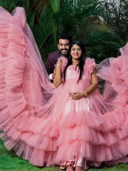 Celebrate your journey to motherhood with our special collection of maternity photoshoot gowns. This dramatic pink ruffled gown is designed for comfort and style, ensuring you get those breathtaking shots you've always dreamed of.