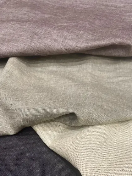 A variety of linen suiting fabrics. These materials are perfect for creating custom jackets, trousers, and Safari shirts, offering both style and comfort for the discerning gentleman.
