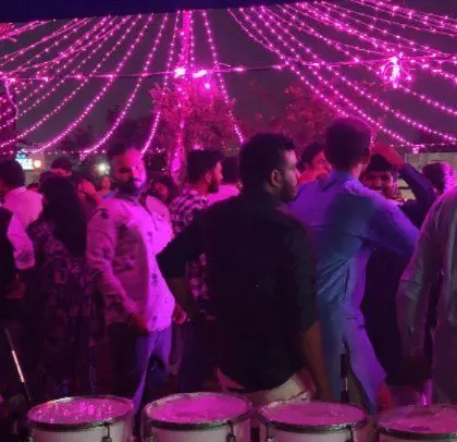 The dance floor is packed at this outdoor corporate Diwali party.
