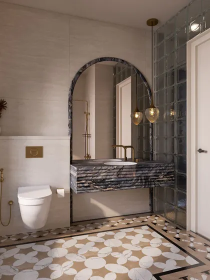 The vanity area continues the bathroom's elegant theme with a floating marble sink and an arched mirror. The patterned floor inlay adds another layer of intricate detail.