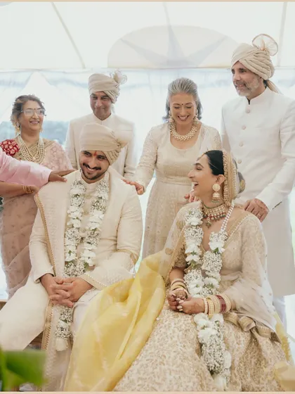 A heartwarming family portrait of Manchal and Luca with their parents during the ceremony. The image is full of love, laughter, and generational blessing.