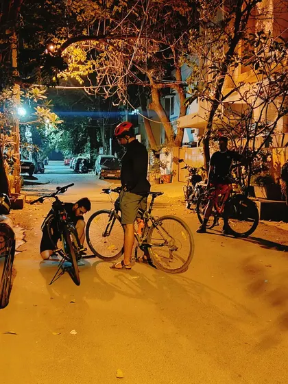 A candid moment during our Republic Day ride, with one cyclist checking on his bike. We casually ride through quiet lanes, but we always make sure our gear is in check and we look out for one another.