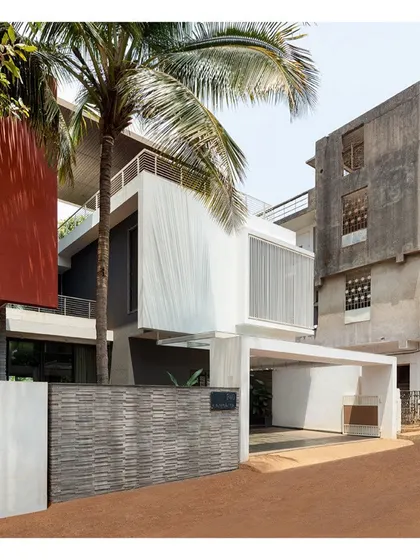 The 'Solid | Void | Solid House', completed in 2021. From the street, the house appears as a composition of opaque and transparent volumes, hinting at the private court at the back.
