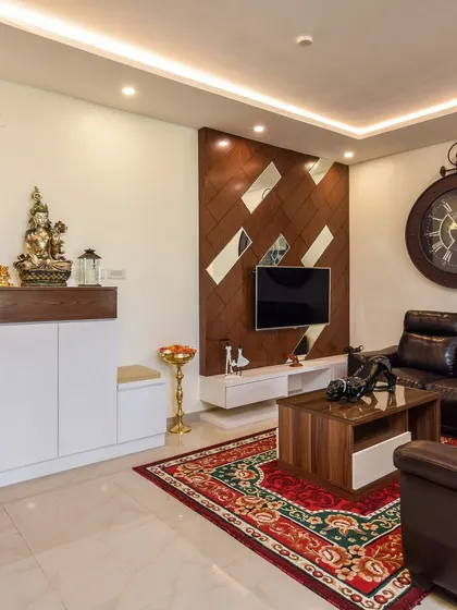 Another angle of the living room, focusing on the Ganesha idol placed on the entryway cabinet, demonstrating how we incorporate spiritual elements seamlessly into our modern interior designs.