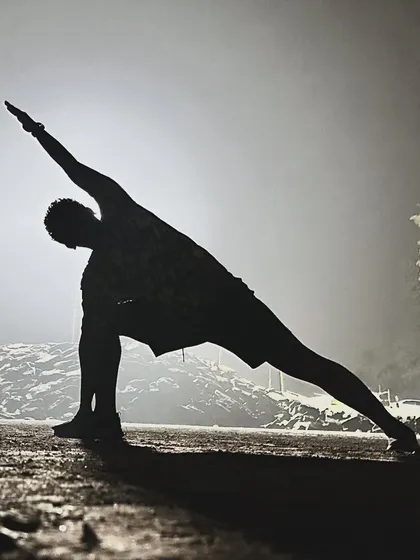 The alignment of asanas should also help align our thoughts, speech, and action off the mat. Practicing Utthita Parsvakonasana.