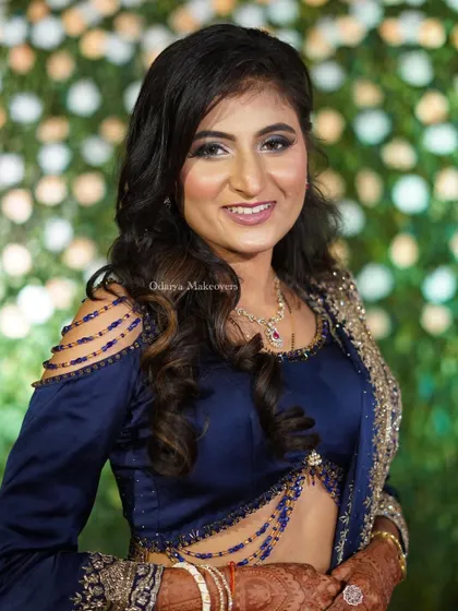 A full-frontal view of the glamorous reception makeup. The combination of a bold eye and a neutral lip is a timeless choice for any evening event.