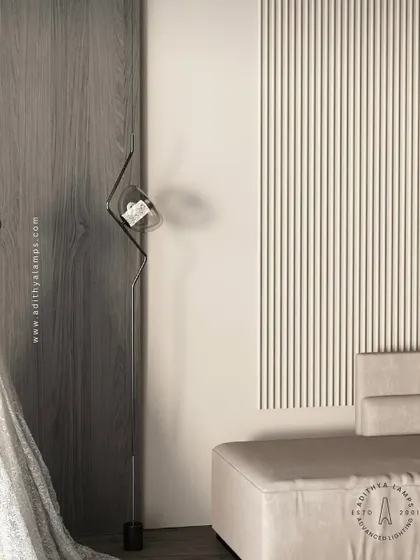 An innovative ceiling-to-floor light installation. This fixture uses tension wires to create a slender, minimalist line of light with a single adjustable spotlight, adding a dramatic and futuristic element to any modern space.