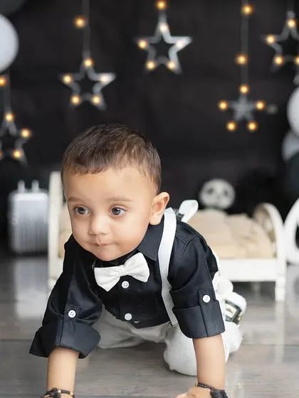 A dapper little gentleman is turning one! This black and white themed shoot with stars is so chic and modern.
