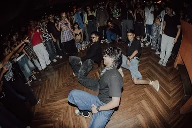 In the zone with my crew during a live club performance. We feed off the crowd's energy to create an unforgettable party atmosphere.