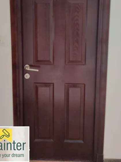 A classic four-panel door with a dark wood stain and finish. This timeless look adds elegance to any interior.