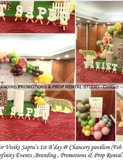 A lovely giraffe theme for a first birthday at the Chancery Pavilion. This setup uses a printed backdrop with a balloon arch in earthy tones, giraffe-patterned cylinder props, and animal cutouts to create a fun and elegant safari look.