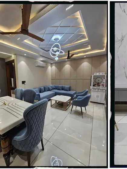 Another angle of the same living room, showing the relationship between the seating area and the dining table. The consistent color palette and materials create a unified and spacious feel.