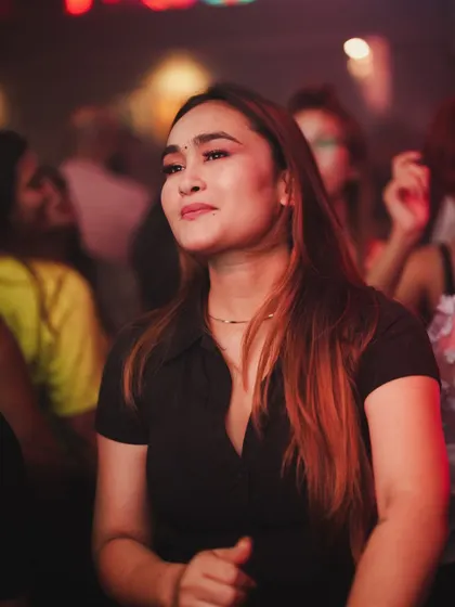 A serene moment on the dance floor, lost in the music.