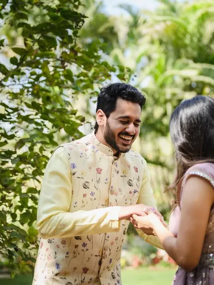 The laughter continues. Capturing these playful interactions during an engagement shoot helps tell the story of the couple's relationship.